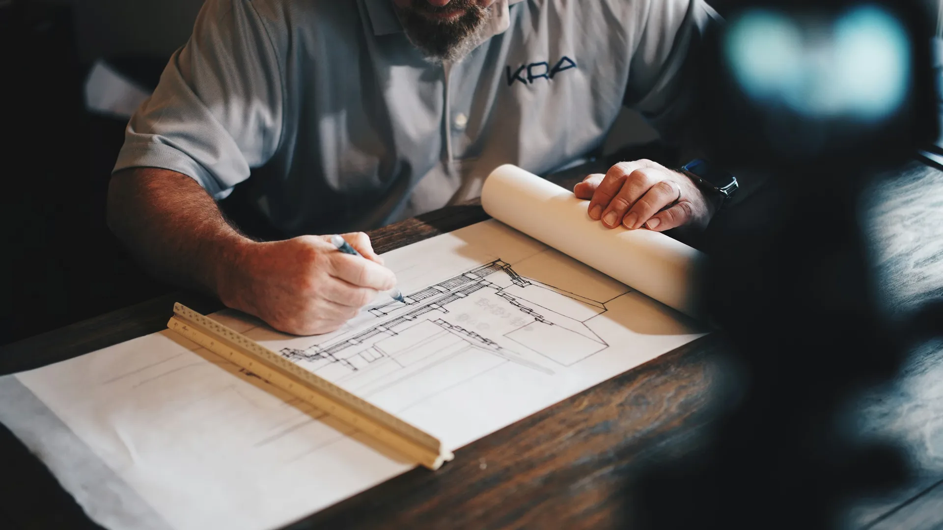 Builder reviewing architectural plans